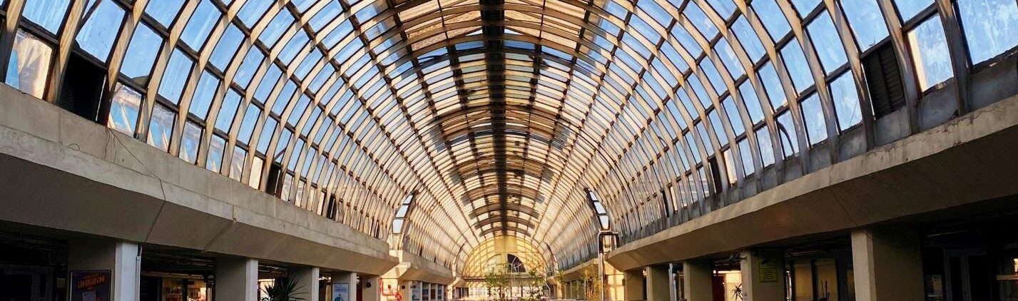 Inside a building with a glass ceiling